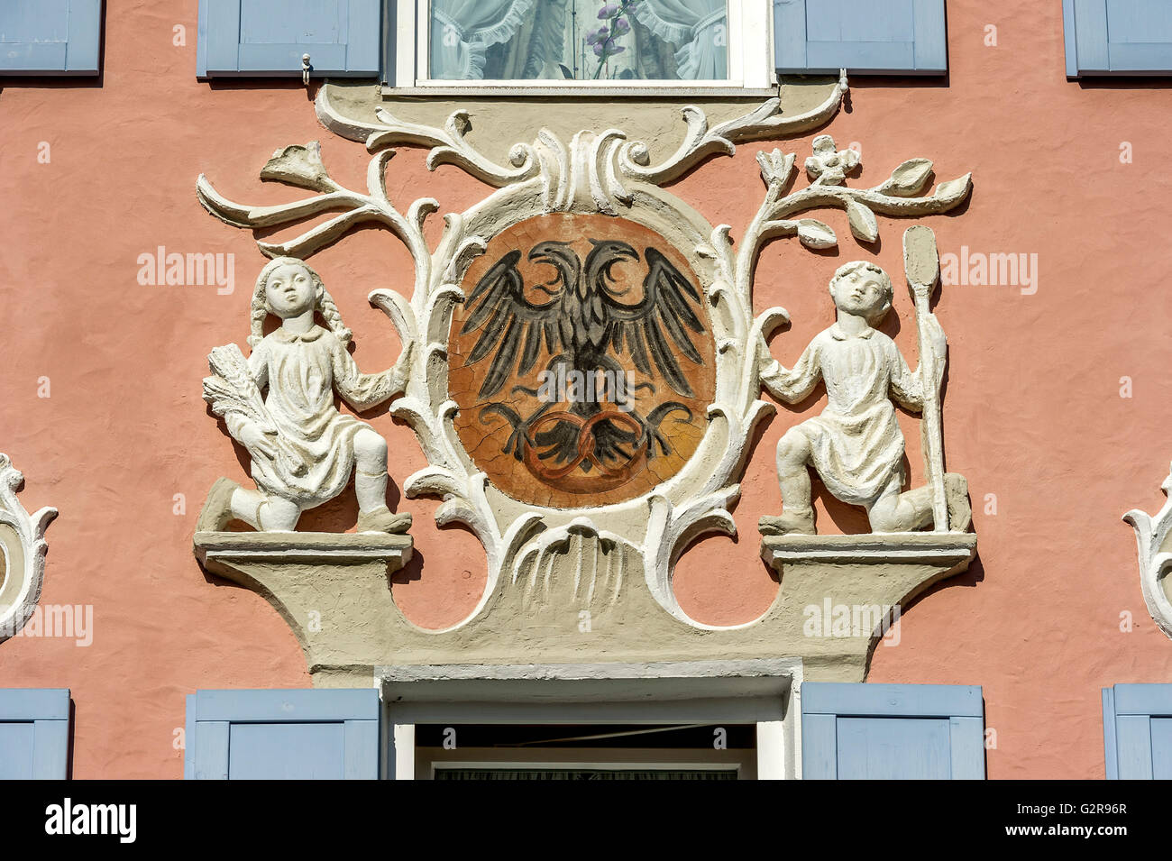 Former bakery with baroque stucco and mural painting with double-headed eagle and pretzel, house Langerbeck, Ludwigstraße Stock Photo