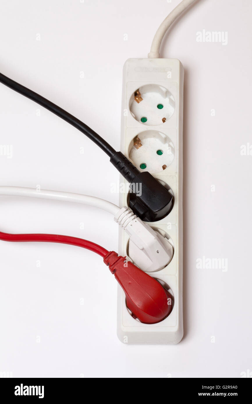 Power strip with three different coloured plugs Stock Photo Alamy