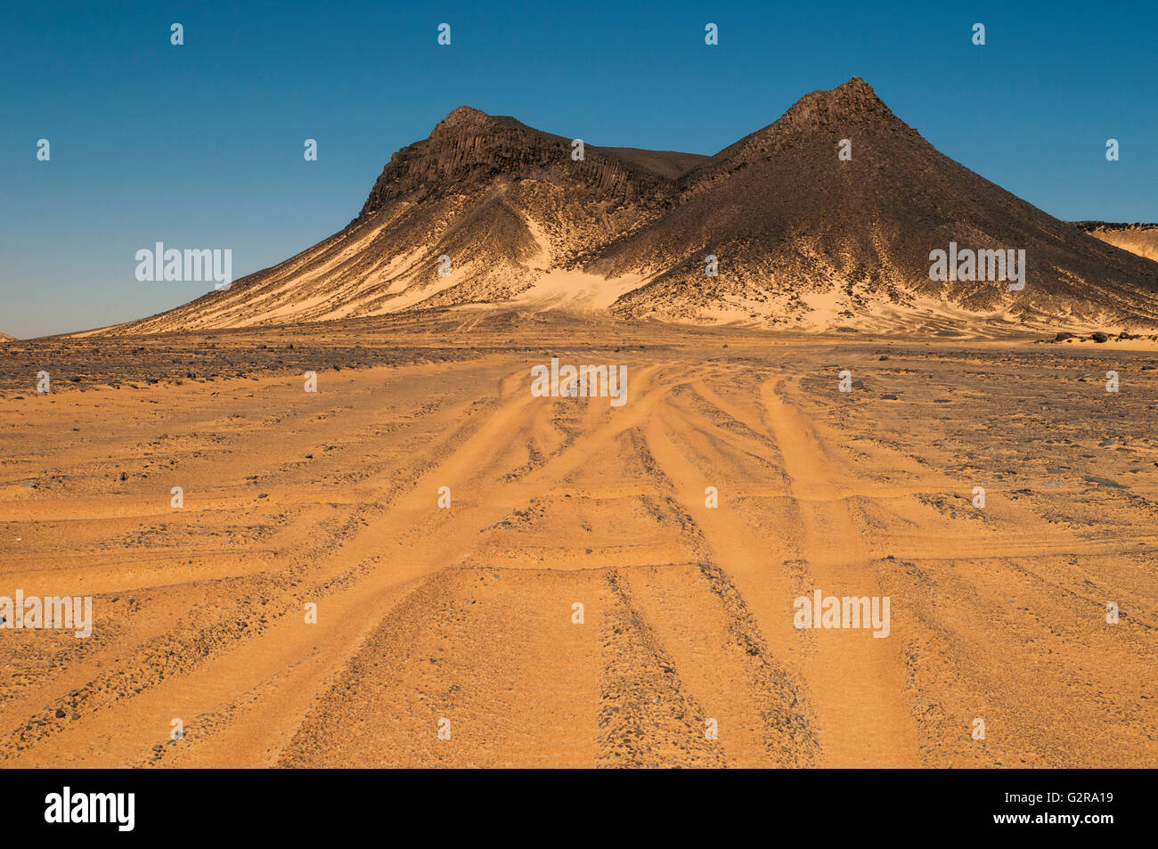 Volcanic mountains of Black Desert, Black Desert, Bahariya, Egypt Stock ...