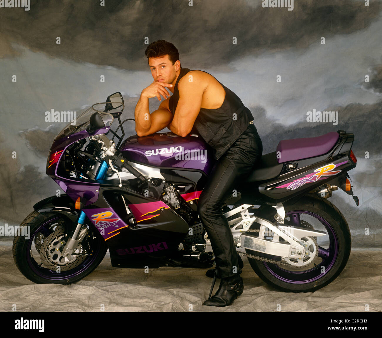 Guy sitting on motorbike Stock Photo