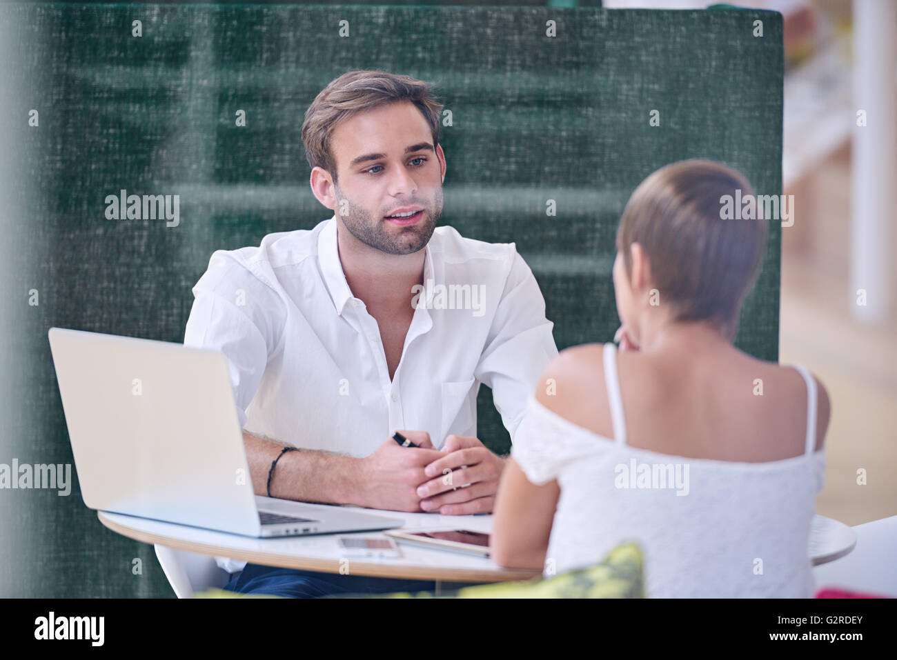 Mentorship between knowledgable male mentor and bright female student Stock Photo