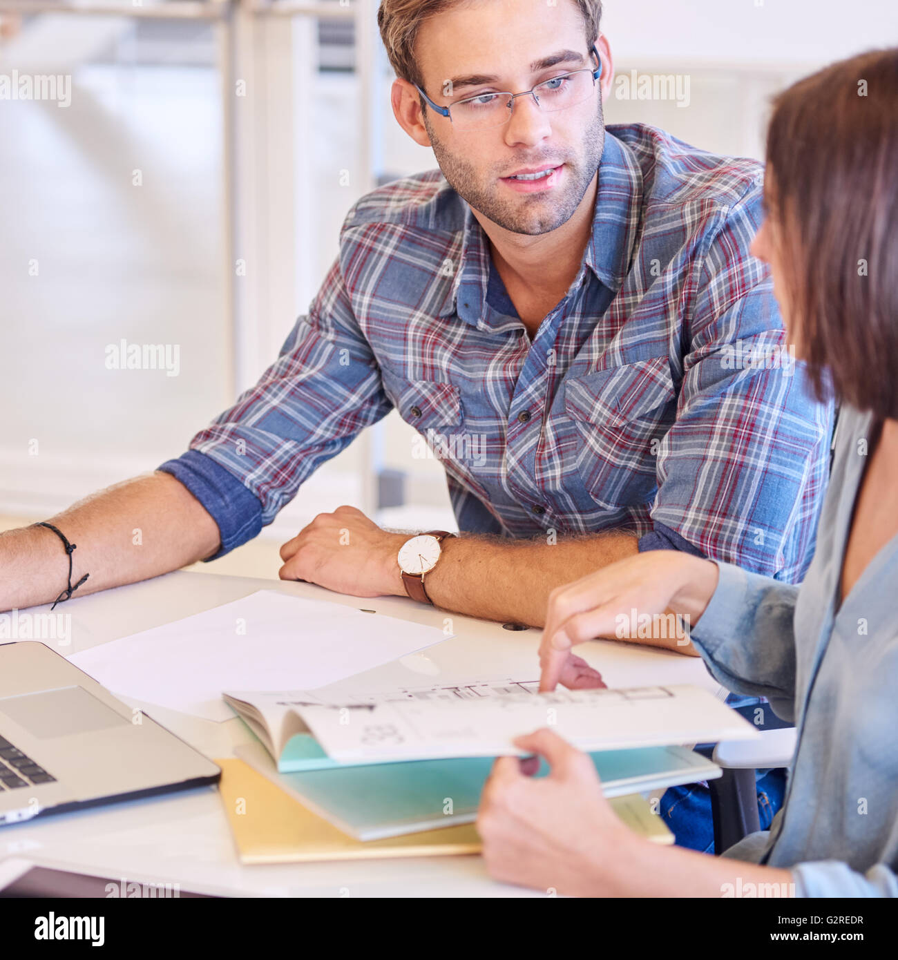 Adult man and woman planning their schedule for upcoming work Stock Photo