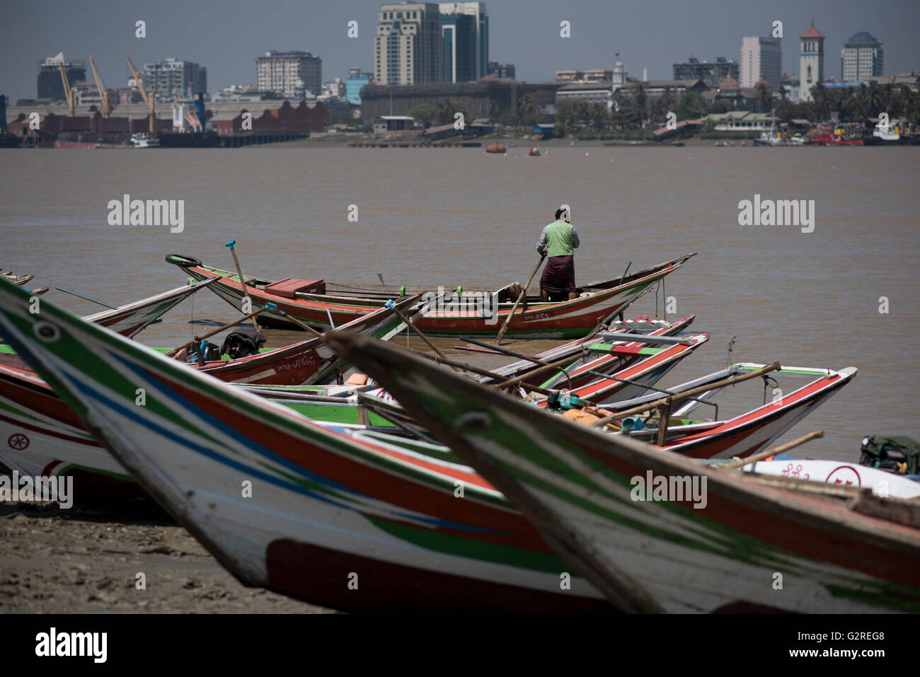 Long tail boats moored at the Yangon River shore in Dala, Yangon