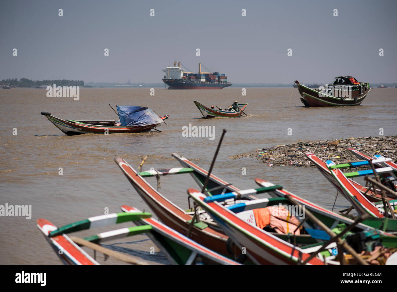 Long tail boats and ships at the Yangon River in Dala, Yangon, Myanmar