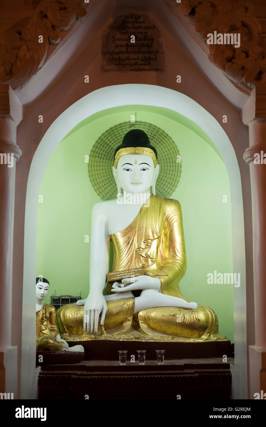 A Buddha statue at the Shwedagon pagoda in Yangon, Myanmar. Stock Photo