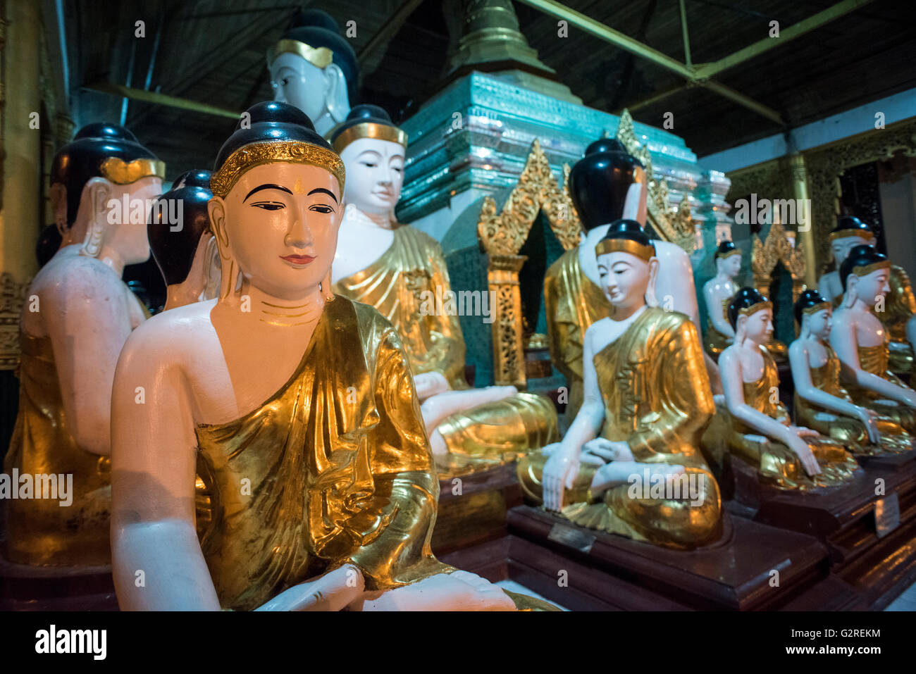 A group of Buddha statues at the Shwedagon pagoda in Yangon, Myanmar. Stock Photo