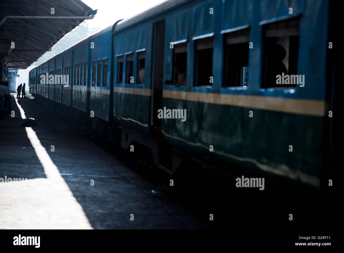 Silhouette of people boarding a train at the Yangon Central Train Station, Myanmar. Stock Photo