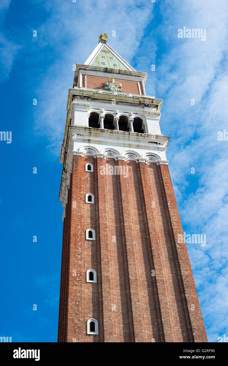 tall brick bell tower at the famous St.Mark square in Venice, Italy Stock Photo