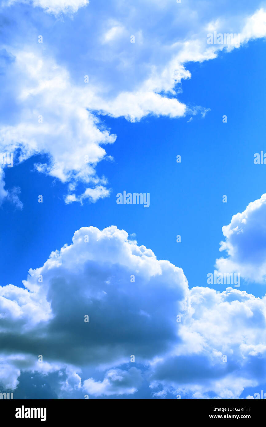 Nature background. Few big white clouds in blue sky Stock Photo - Alamy