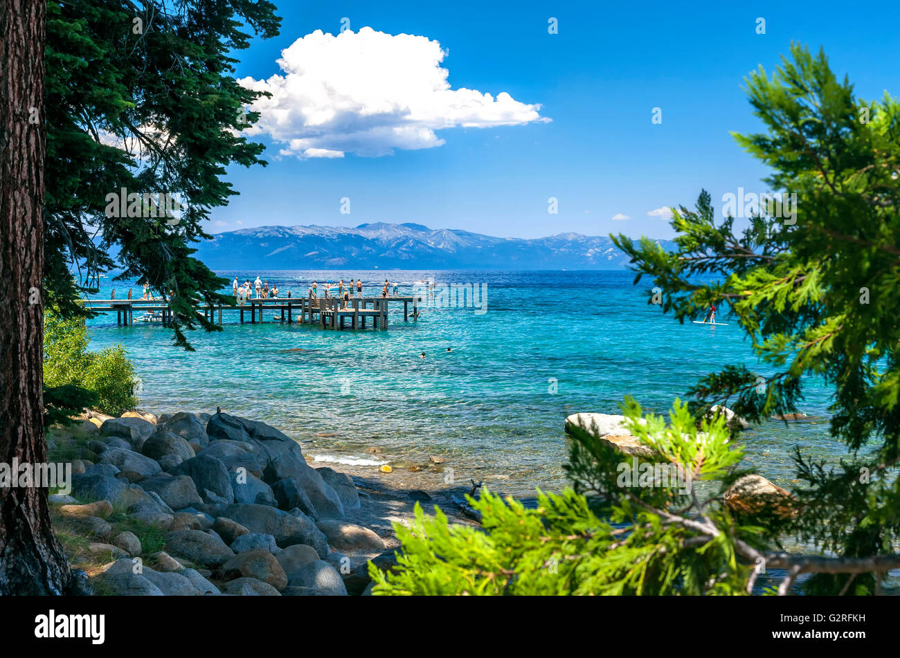 Image of kids playing on the pier at Sugar Pine Point. Stock Photo