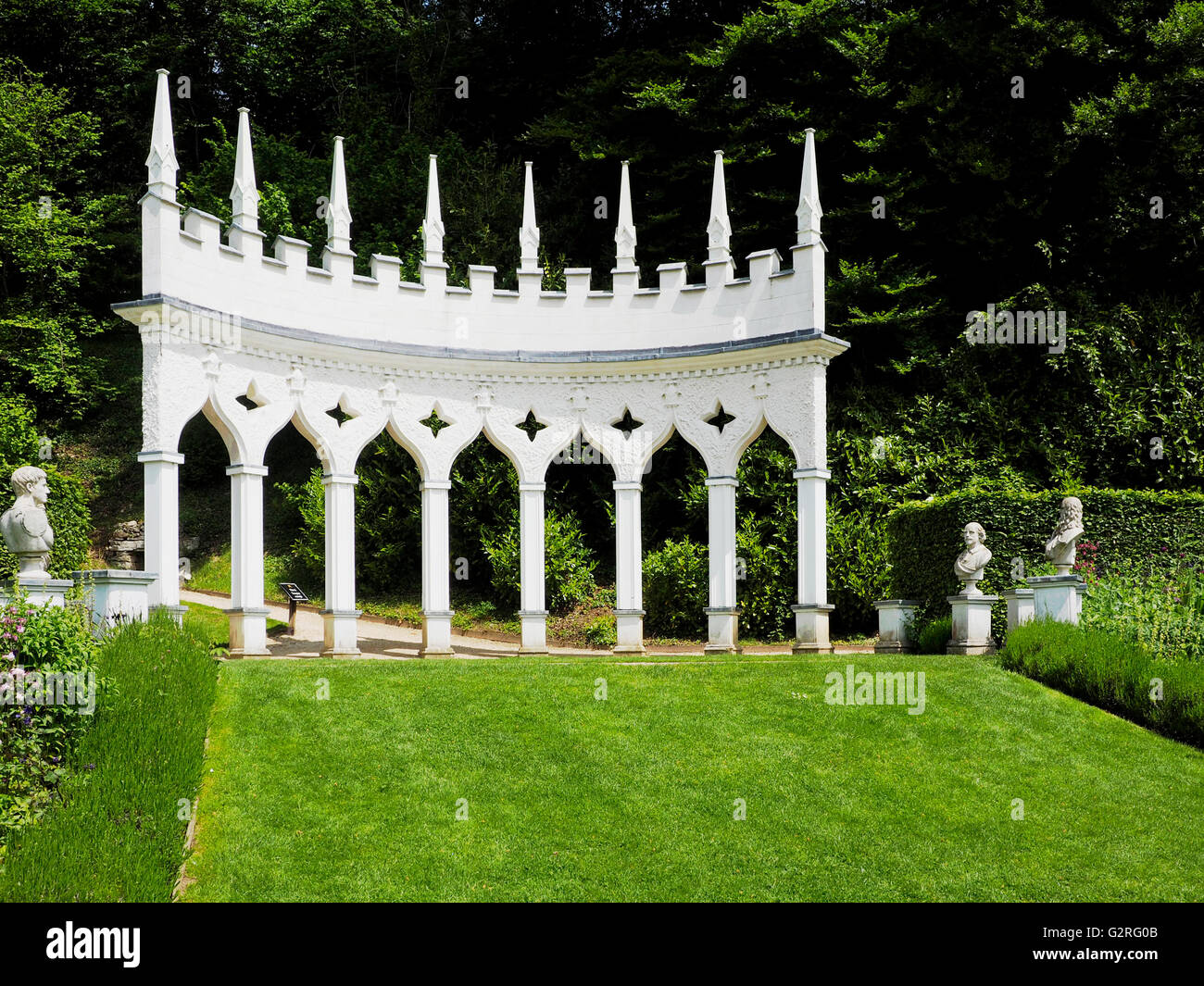 The brilliant white Exedra stands above the Exedra Garden in Painswick Rococo Gardens, Gloucestershire. Stock Photo