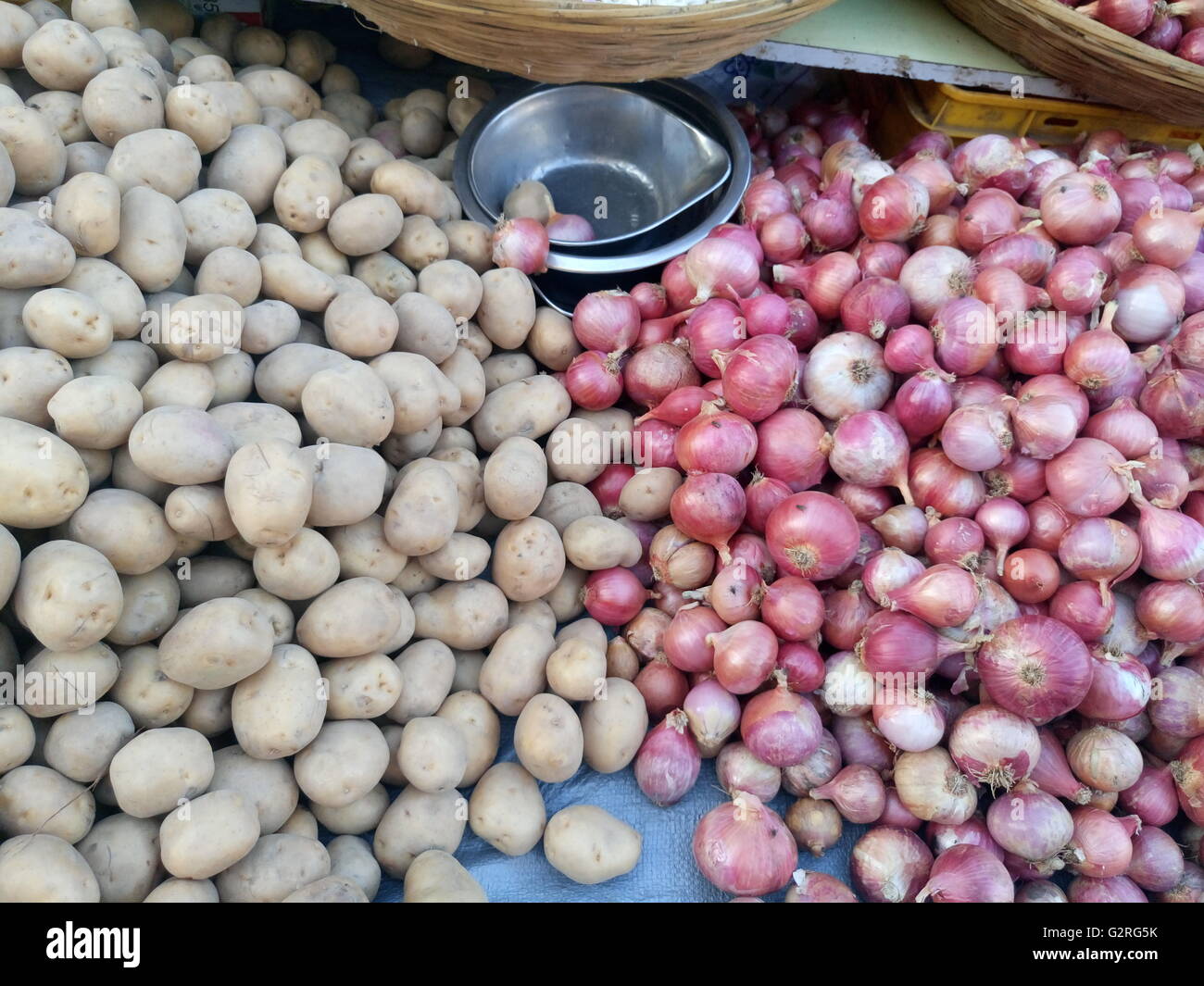 Full frame shot of potatoes and onions for sale Stock Photo