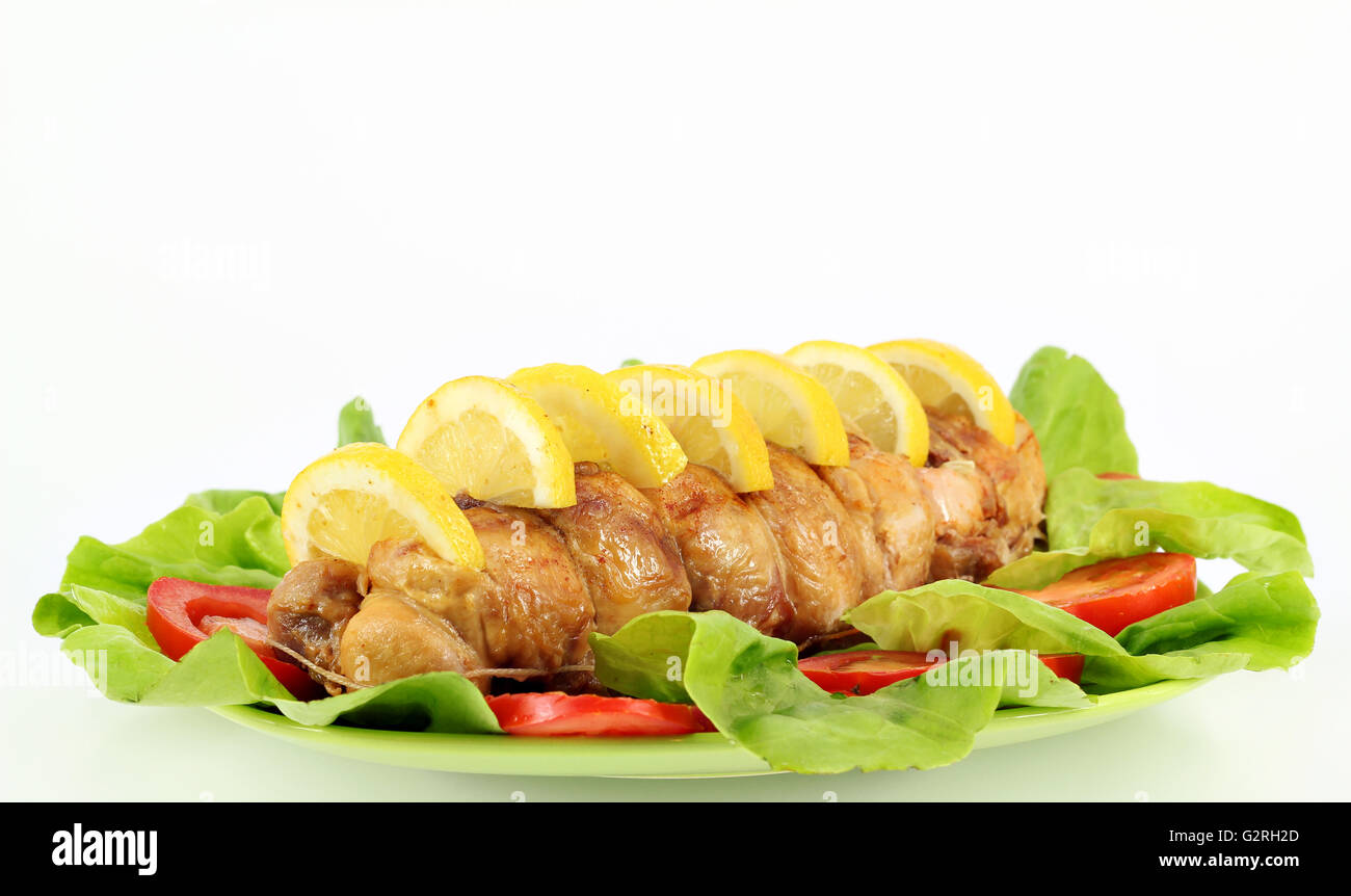 chicken meat with lemon and salad Stock Photo
