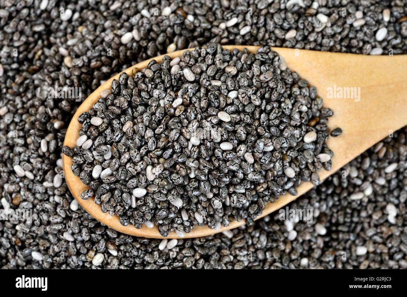 Chia seeds in wooden spoon closeup Stock Photo