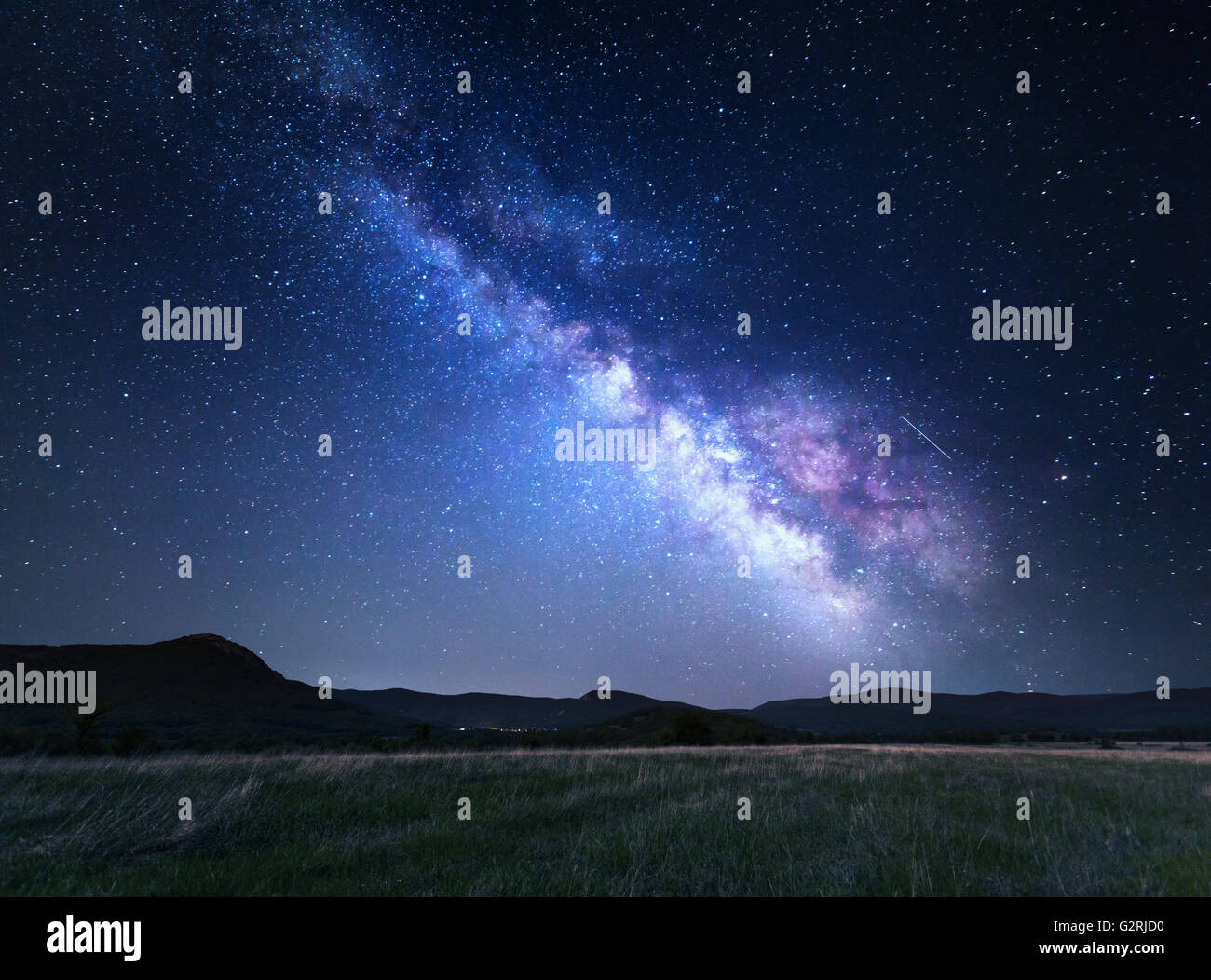 Landscape with blue Milky Way. Night sky with stars at mountains, Universe, beautiful mountain valley Stock Photo