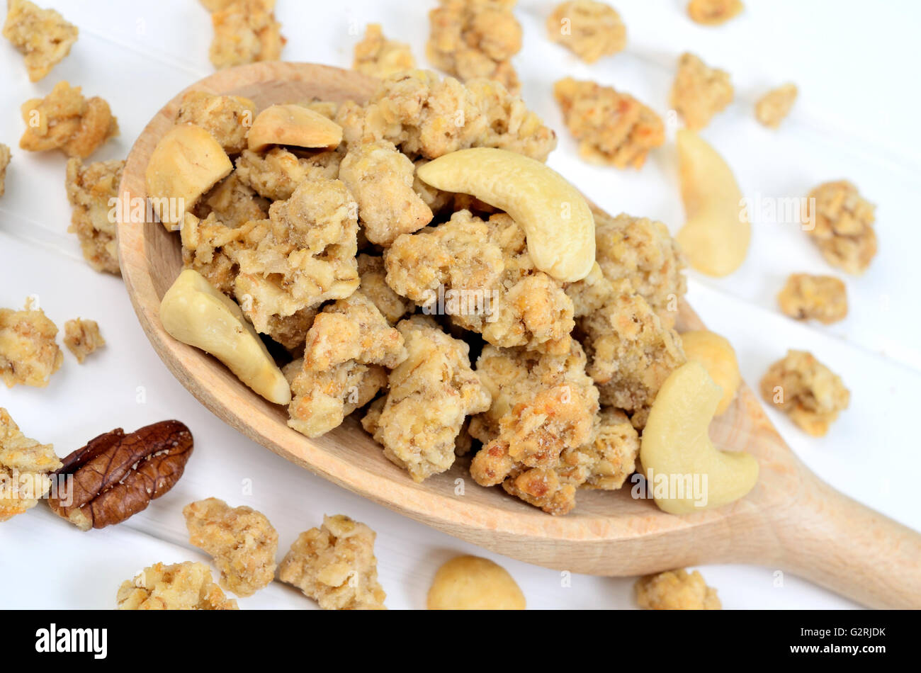 Healthy muesli in a wooden spoon Stock Photo