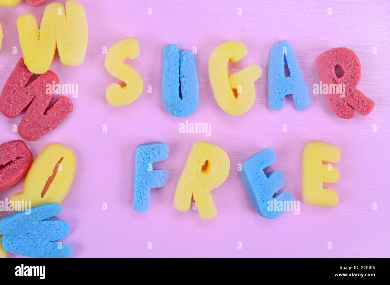 The words Sugar free on pink wooden table Stock Photo
