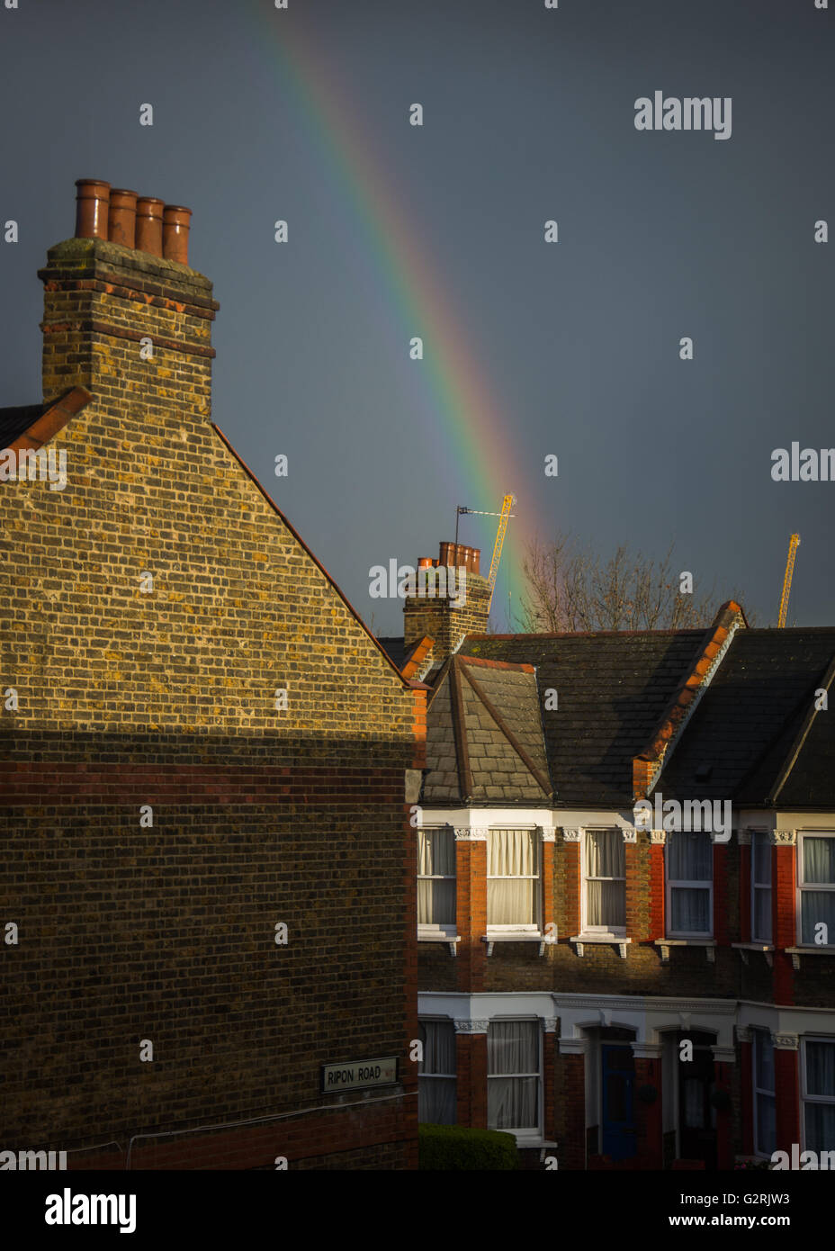 Rainbow on Victorian terraced houses in Tottenham, North London, UK Stock Photo
