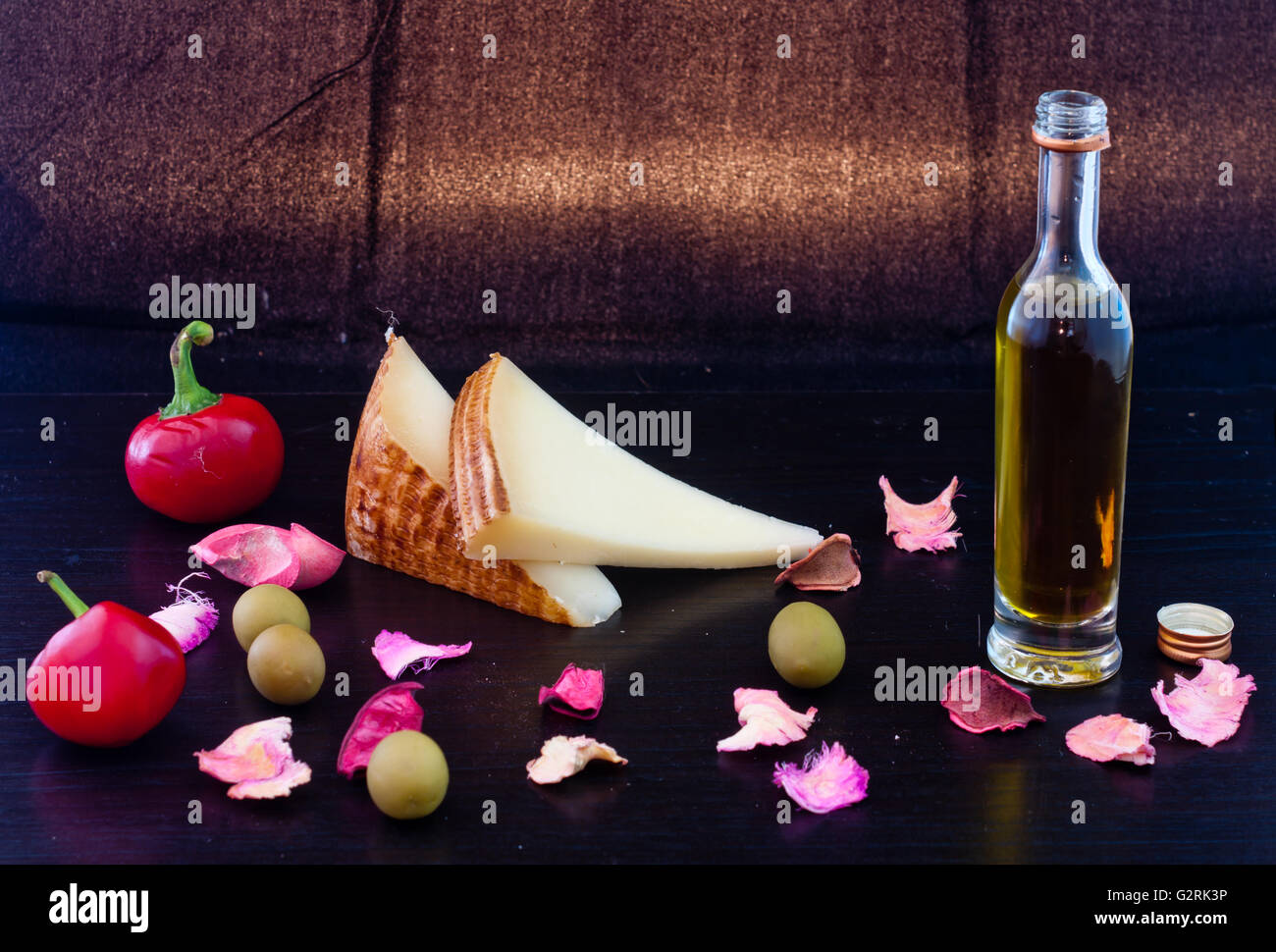 Spicy chilies, cheese and olive oil, Mediterranean and relish appetizer healthy for pasta, bread or rice Stock Photo