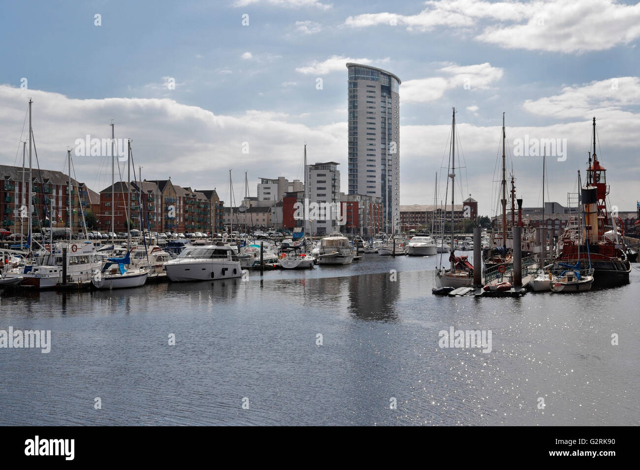 Swansea marina full of boats with the Tower, Wales UK. Quayside flats
