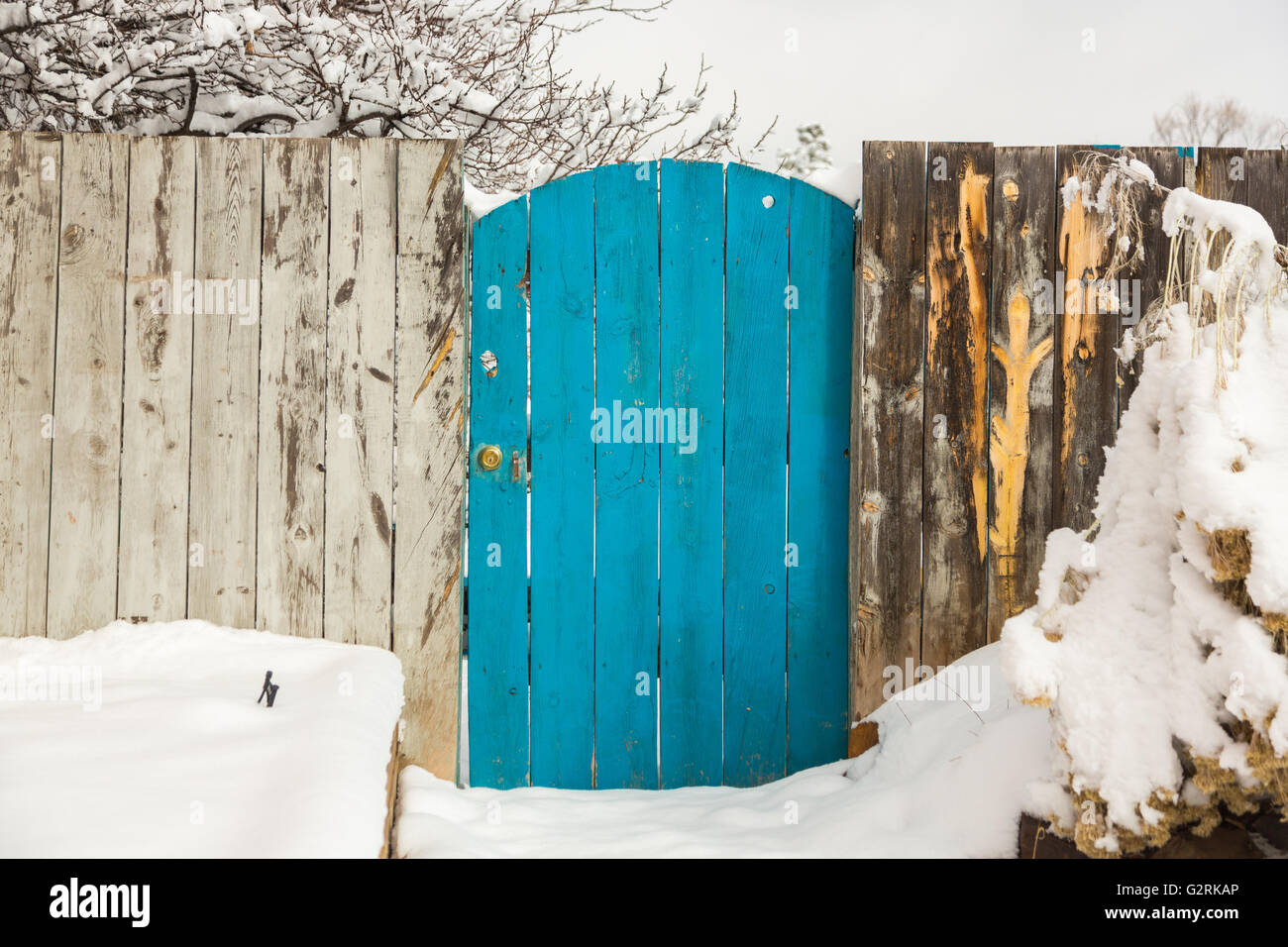 A turquoise door along Canyon Road after a winter snowfall December 13