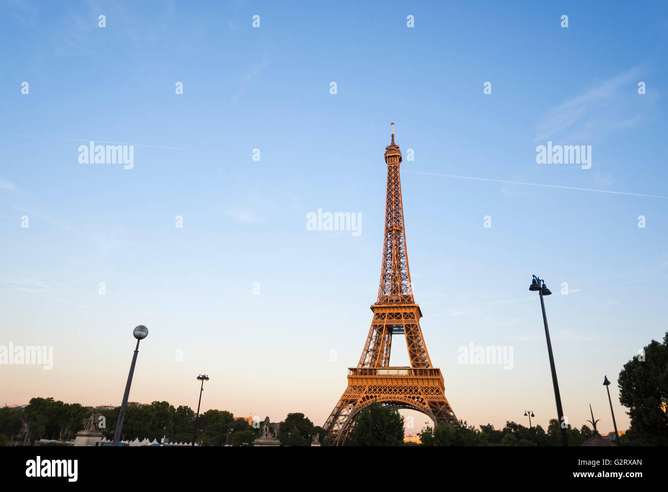 The only structure illuminated by the sunset seen from the Jardins du Trocadero, Paris, France. Stock Photo