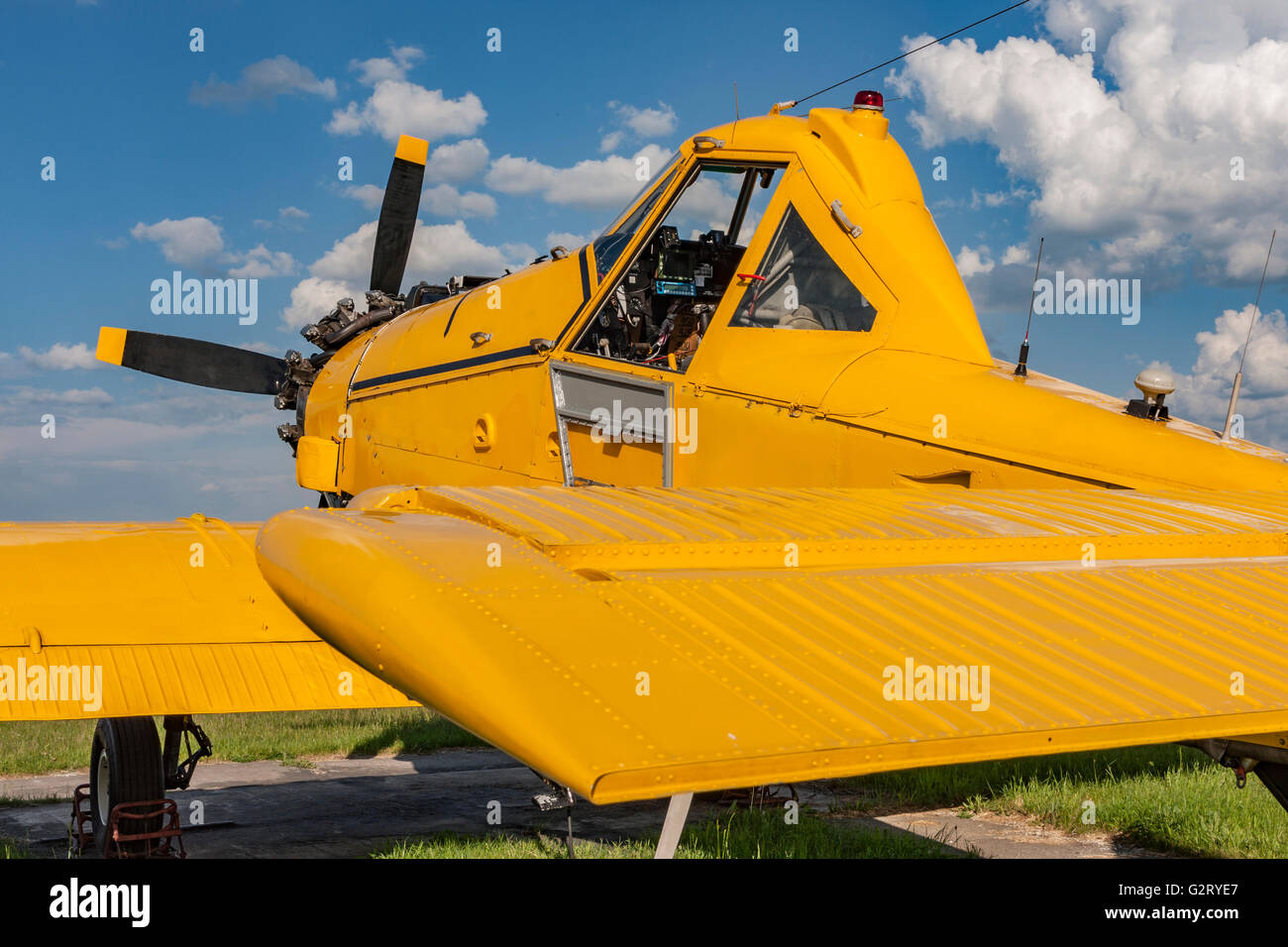 Yellow agricultural aircraft ready for flight, visible cockpit Stock Photo