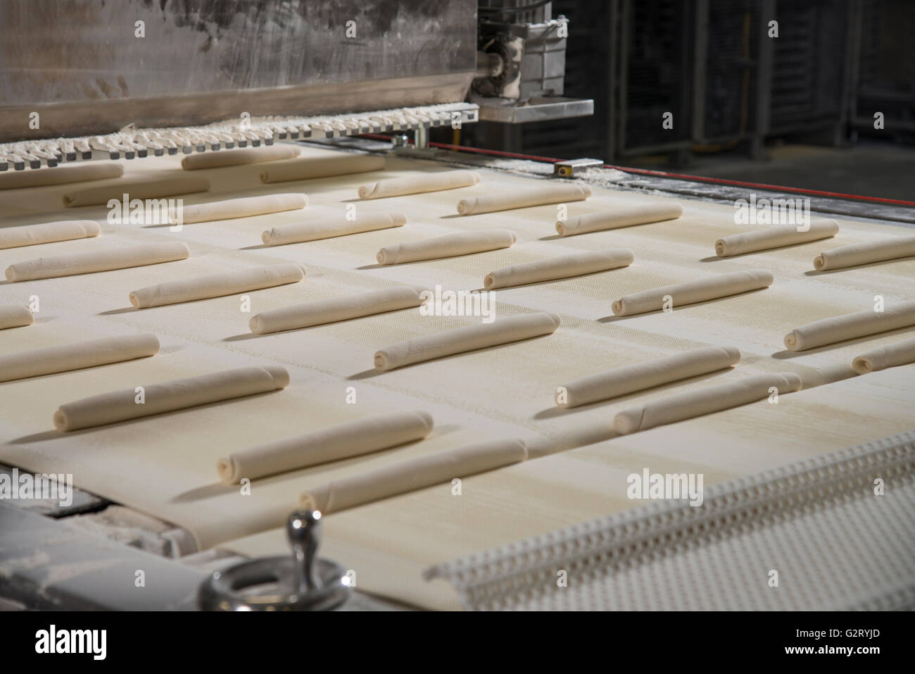 Raw Dough On Conveyor Belt, Bread Bakery, Philadelphia USA Stock Photo