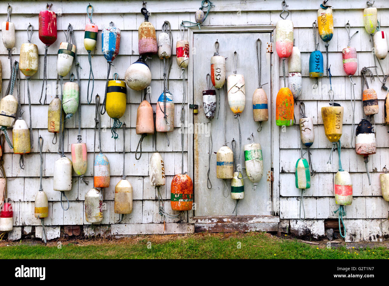 OR02145-00...OREGON - Floats hanging on a shed wall in the town of Warrenton. Stock Photo