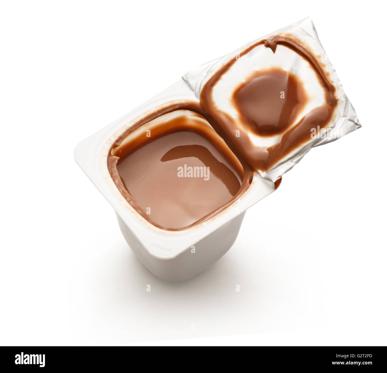 Open yogurt in pot on white in closeup Stock Photo Alamy