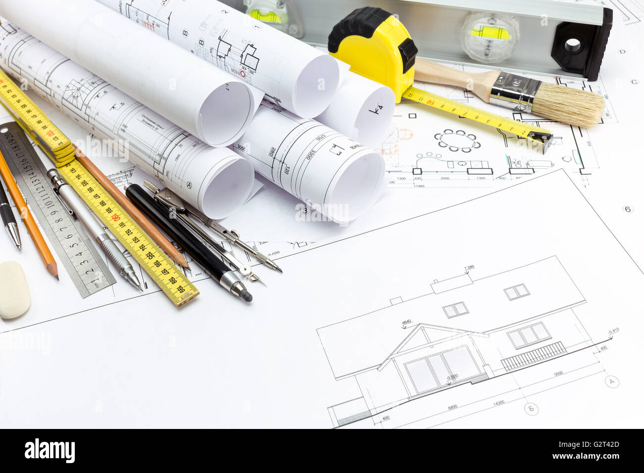 Architectural background with technical drawings and work tools Stock Photo