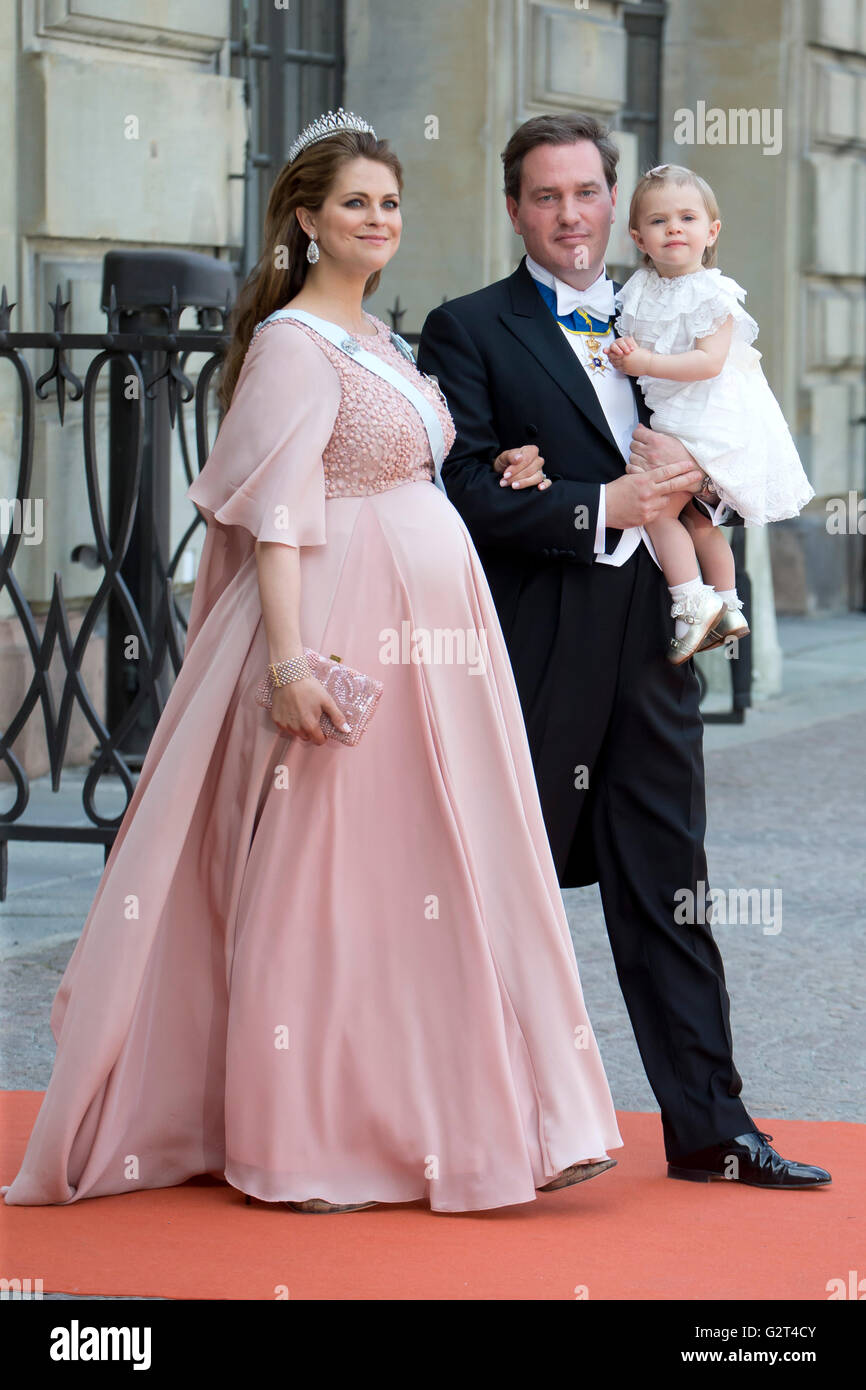 Princess Madeleine of Sweden, Christopher O'Neill, and Princess Leonore, attend Prince Carl Philip of Sweden's Wedding Stock Photo