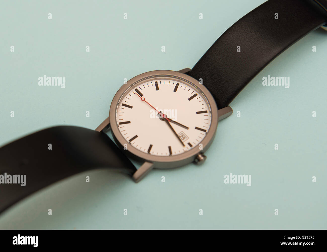 Men's watch with black leather strap Stock Photo