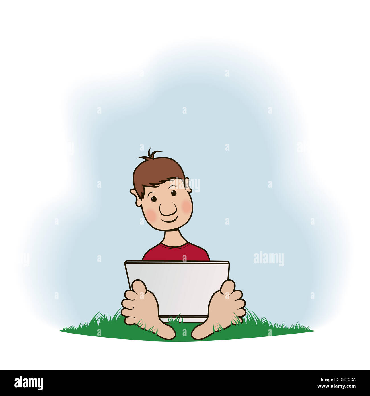 A boy with a notebook sits on a grass Stock Photo - Alamy