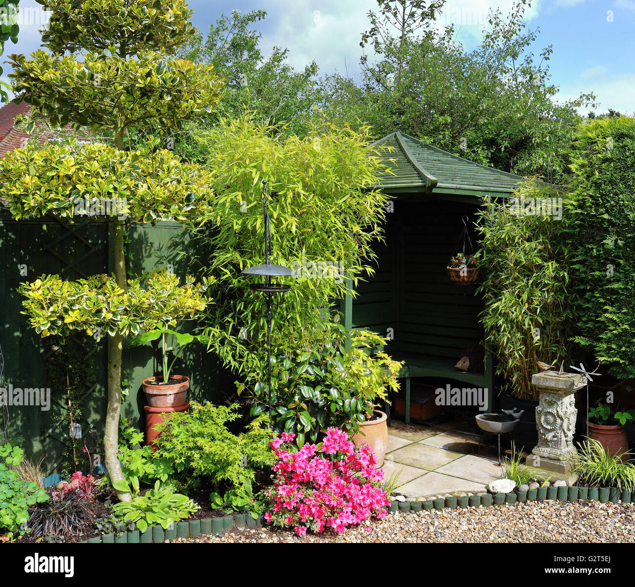 English back Garden with Gazebo and bird feeders Stock Photo