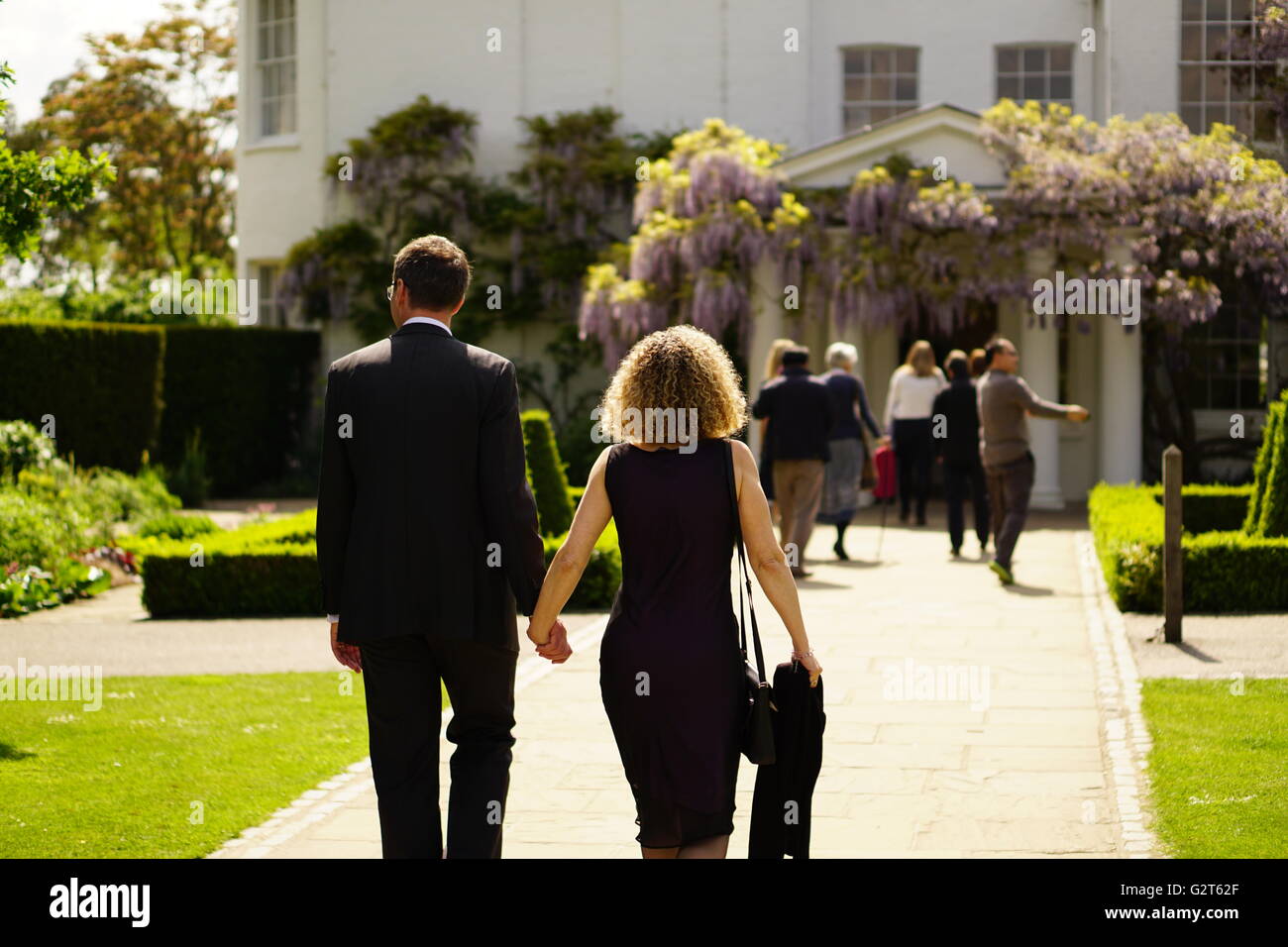 Couple at a funeral. Sunny Afternoon Stock Photo