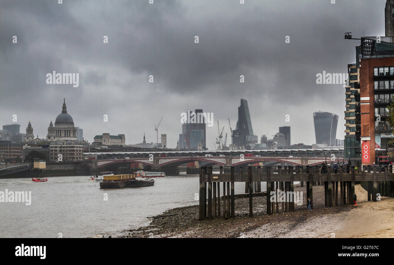 St Pauls Cathedral and The City of London from The South Bank of The River Thames at low tide, London, UK Stock Photo