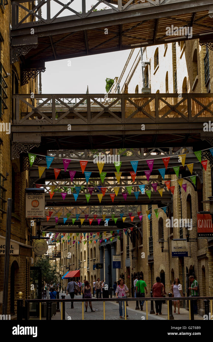 Overhead goods gantries linking old warehouses at Shad Thames now converted into luxury apartments and Shops, Shad Thames, Southwark, London ,UK Stock Photo