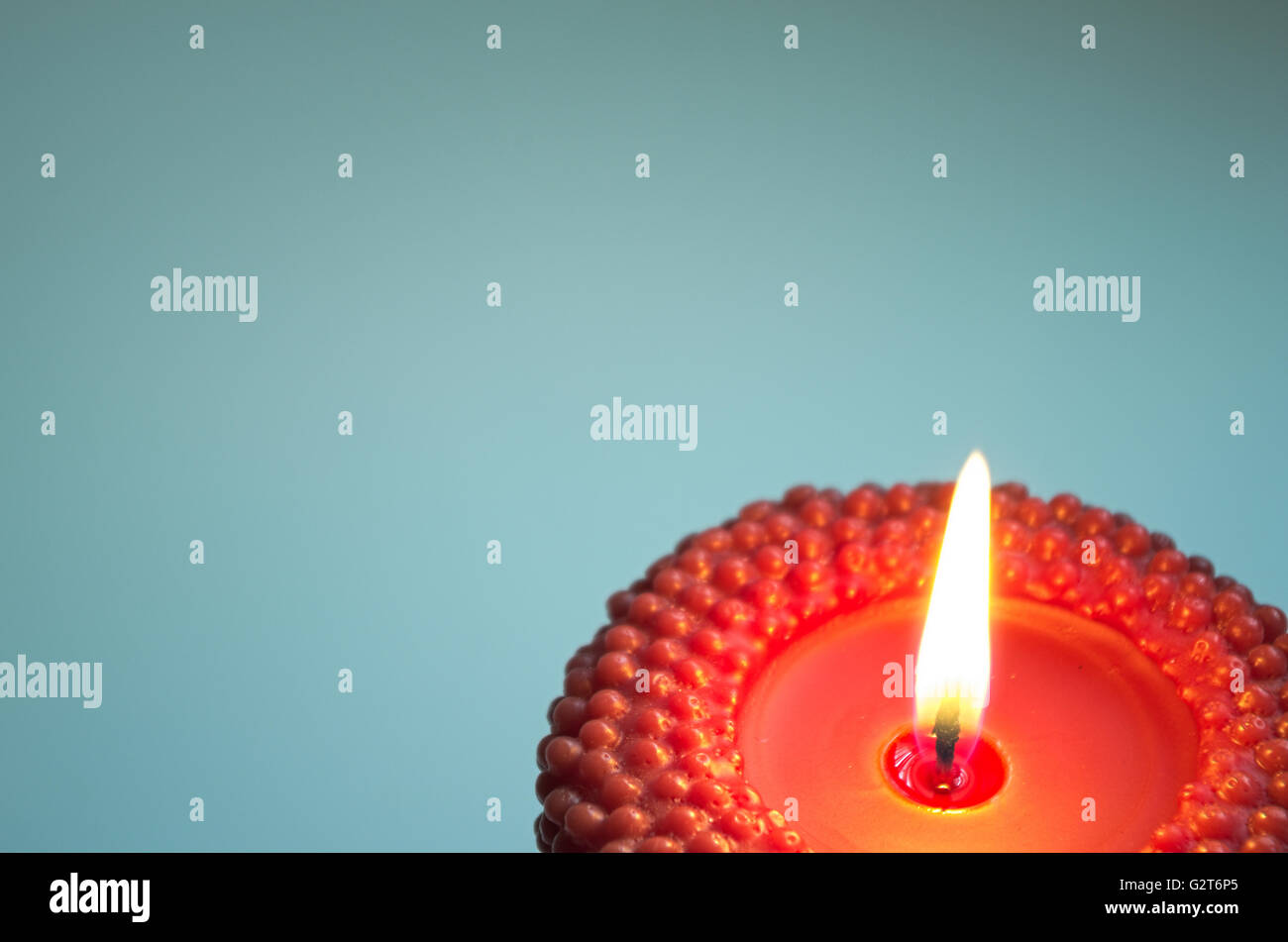 Candlelit background. Red candle closeup Stock Photo Alamy