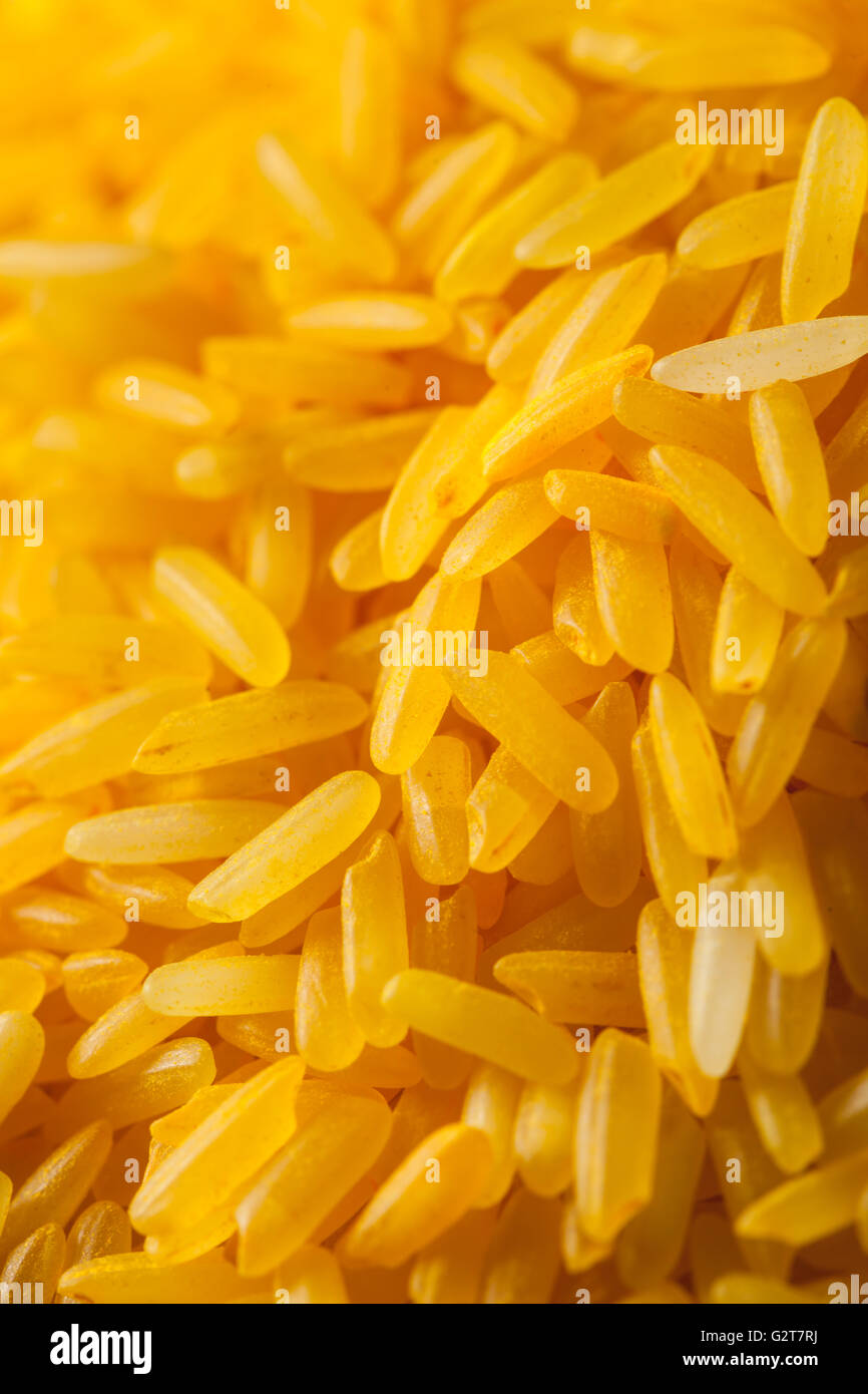 Uncooked golden rice grain hi-res stock photography and images - Alamy