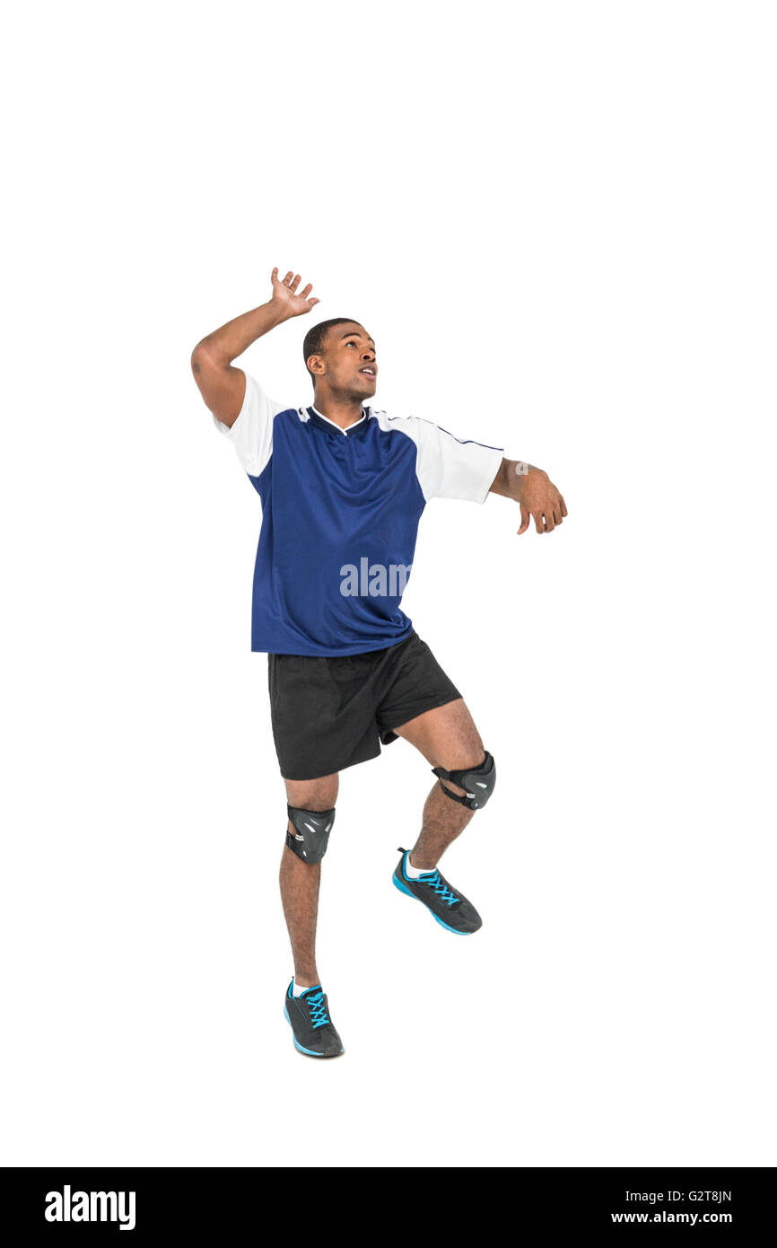 Sportsman posing while playing volleyball Stock Photo