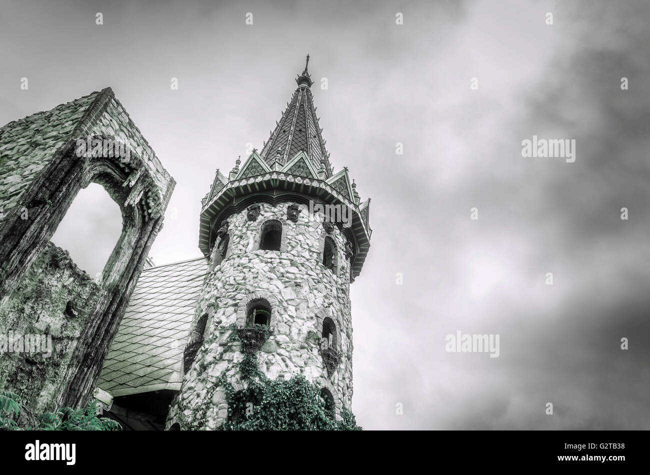 Dark cloudy sky over the old stone castle. Stock Photo