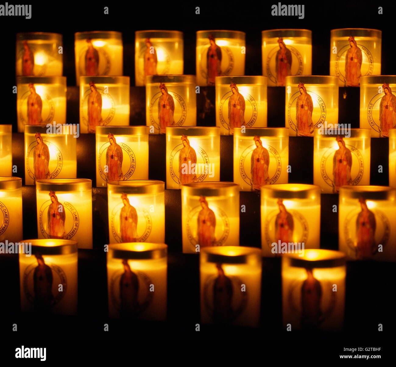 Religious votive candles with images of the Virgin Mary in the Catholic