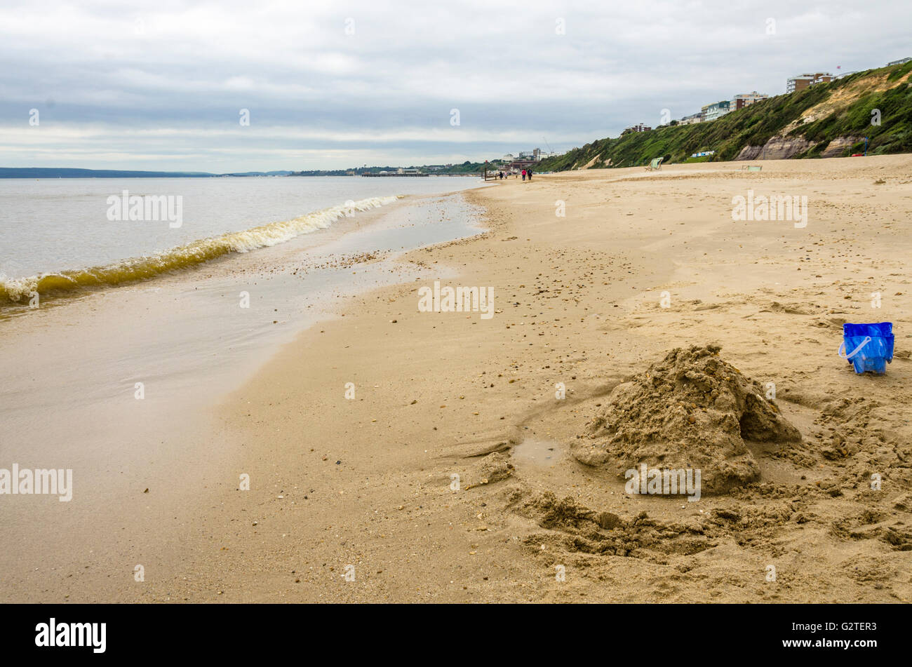 Looking long the water's edge on Boscombe Beach, Bournemouth, UK. Stock Photo