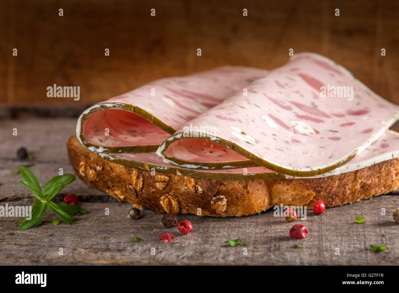 Specialty meat sandwich made with sheep cheese and vine leaves Stock Photo