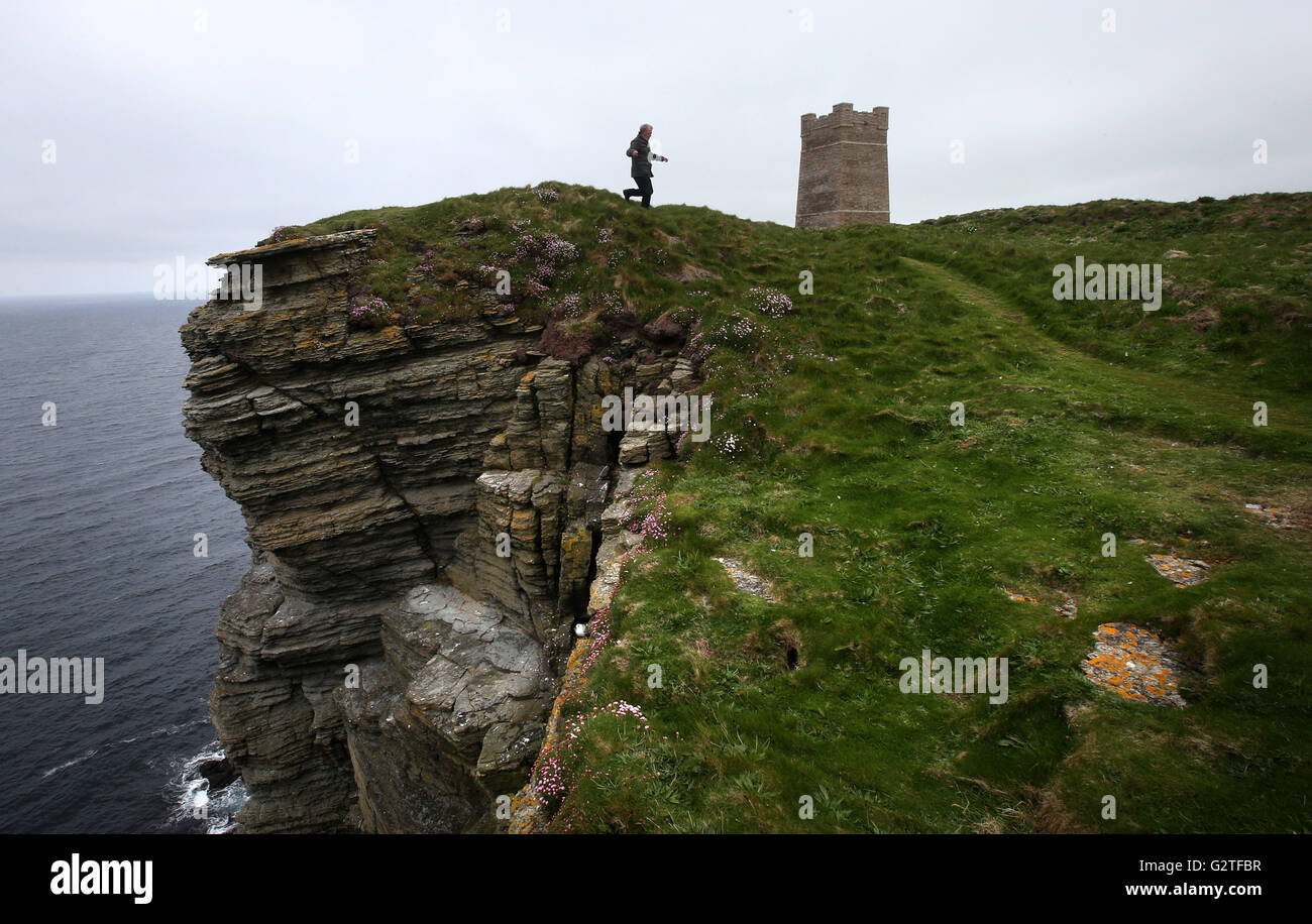 A visitor looks at a tower built to hold the restored Kitchener Memorial, dedicated to Lord Kitchener, at Marwick Head in Orkney, which will be unveiled on Sunday to mark the hundredth anniversary of the sinking of HMS Hampshire. Stock Photo