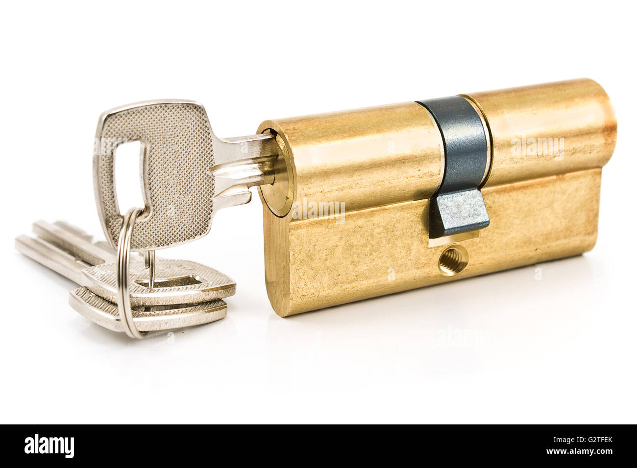 Brass cartridge cylinder with keys isolated on white Stock Photo