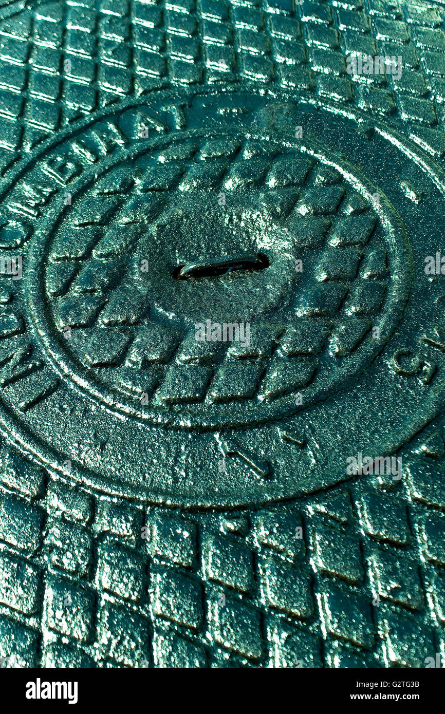 Iron sewer cover as background Stock Photo