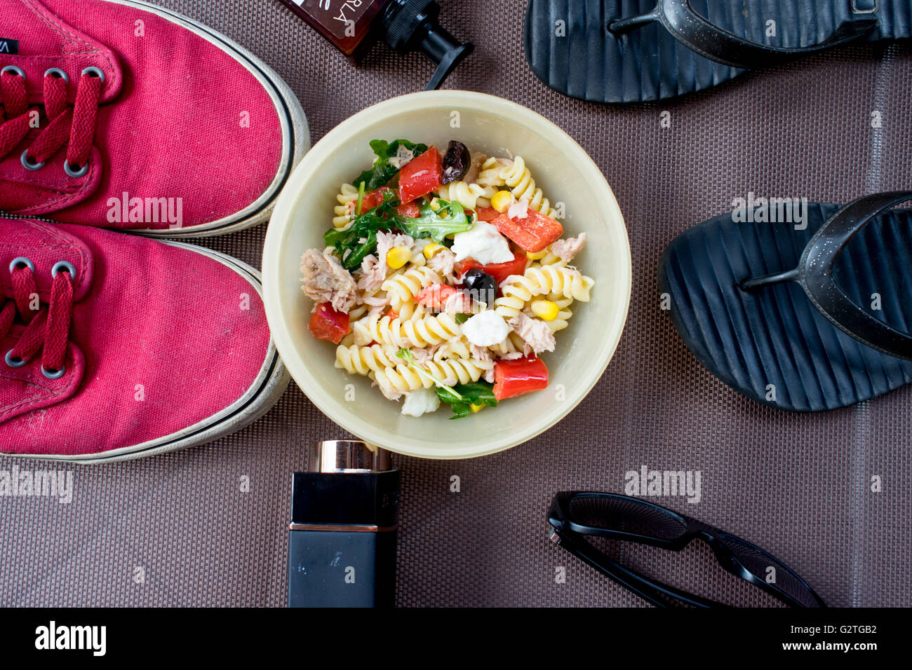 pasta salad with summer clothes and accessories,summer time Stock Photo