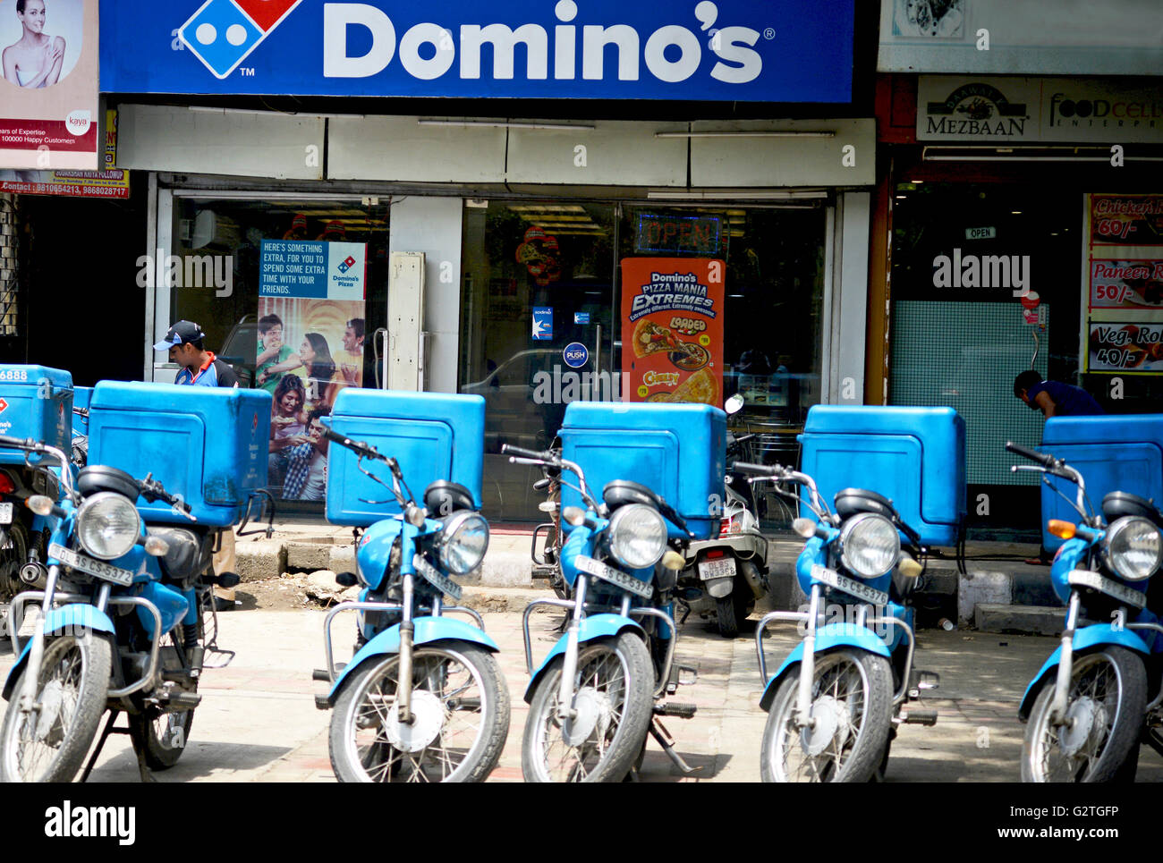 Domino's Restaurant and Delivery bike in a row,India Stock Photo